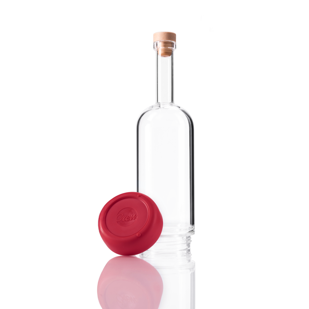 Clear glass Crew Bottle with a removable base Merlot red color on white background