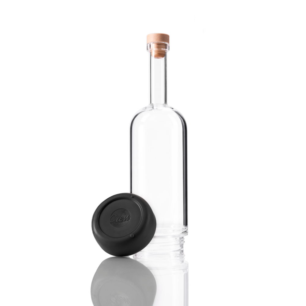 Clear glass Crew Bottle with a removable base Pepper color on white background