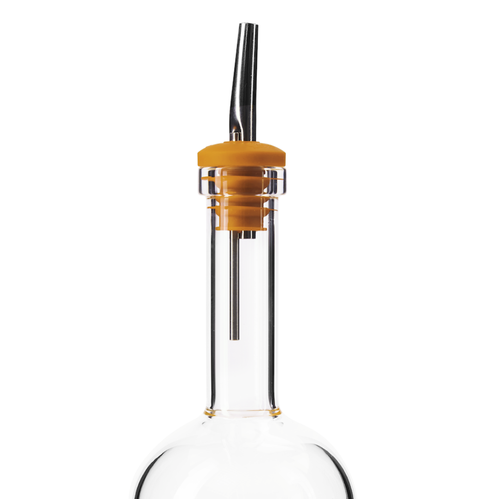 Glass batch bottle with yellow pour spout on a white background