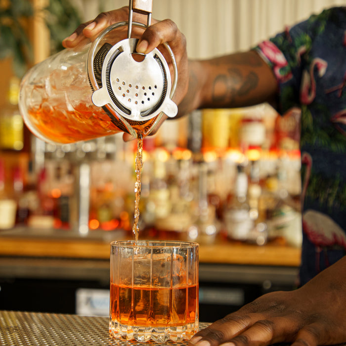 Bartender Pouring from Mixing Glass