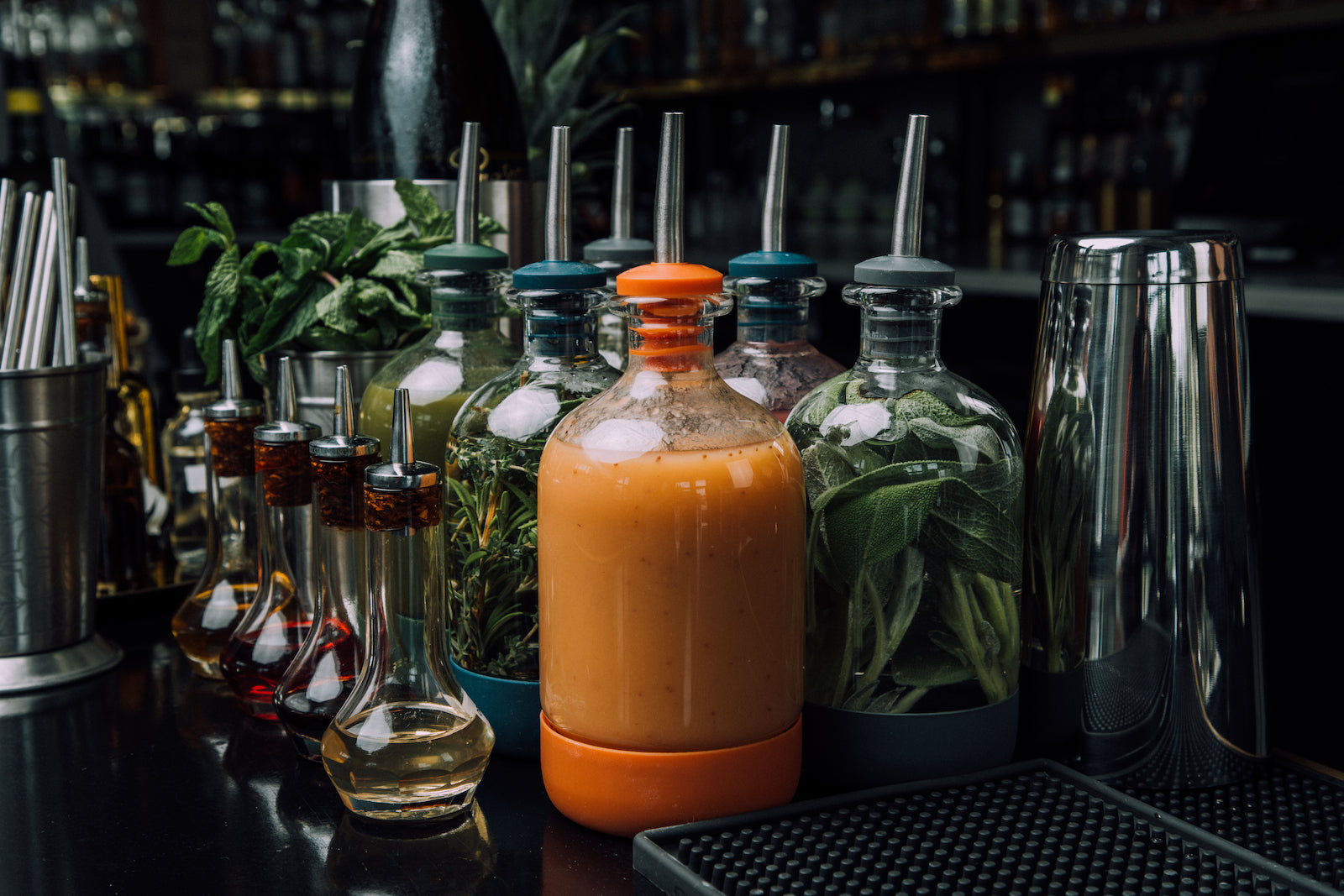 Bar supplies arranged in a dark cocktail bar