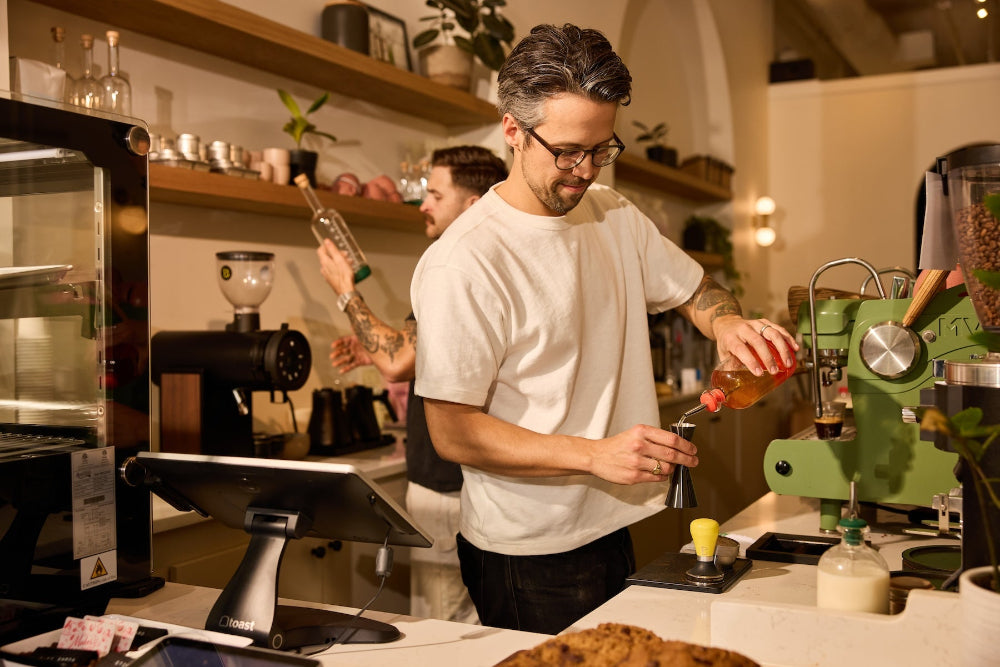 Barista making coffee with Crew Chubby Bottle