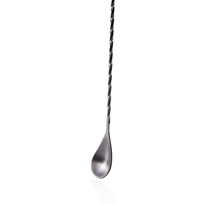 Close up of a cocktail bar spoon with twisted handle on a white background