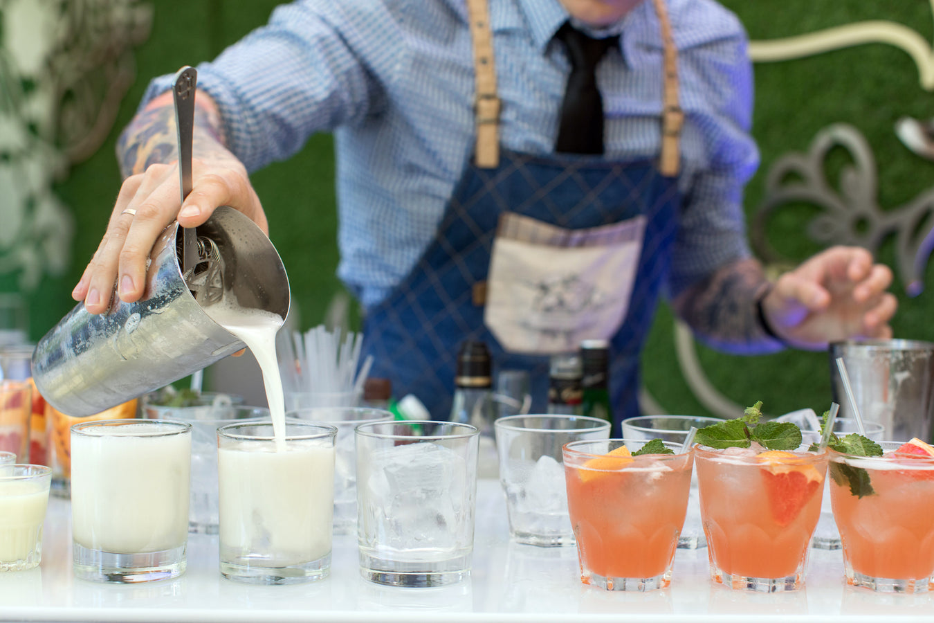 bartender pouring cocktails at catering event