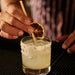 craft cocktail styled with lemon cocktail garnish plant-based straw and lavender lemonade rimming salt