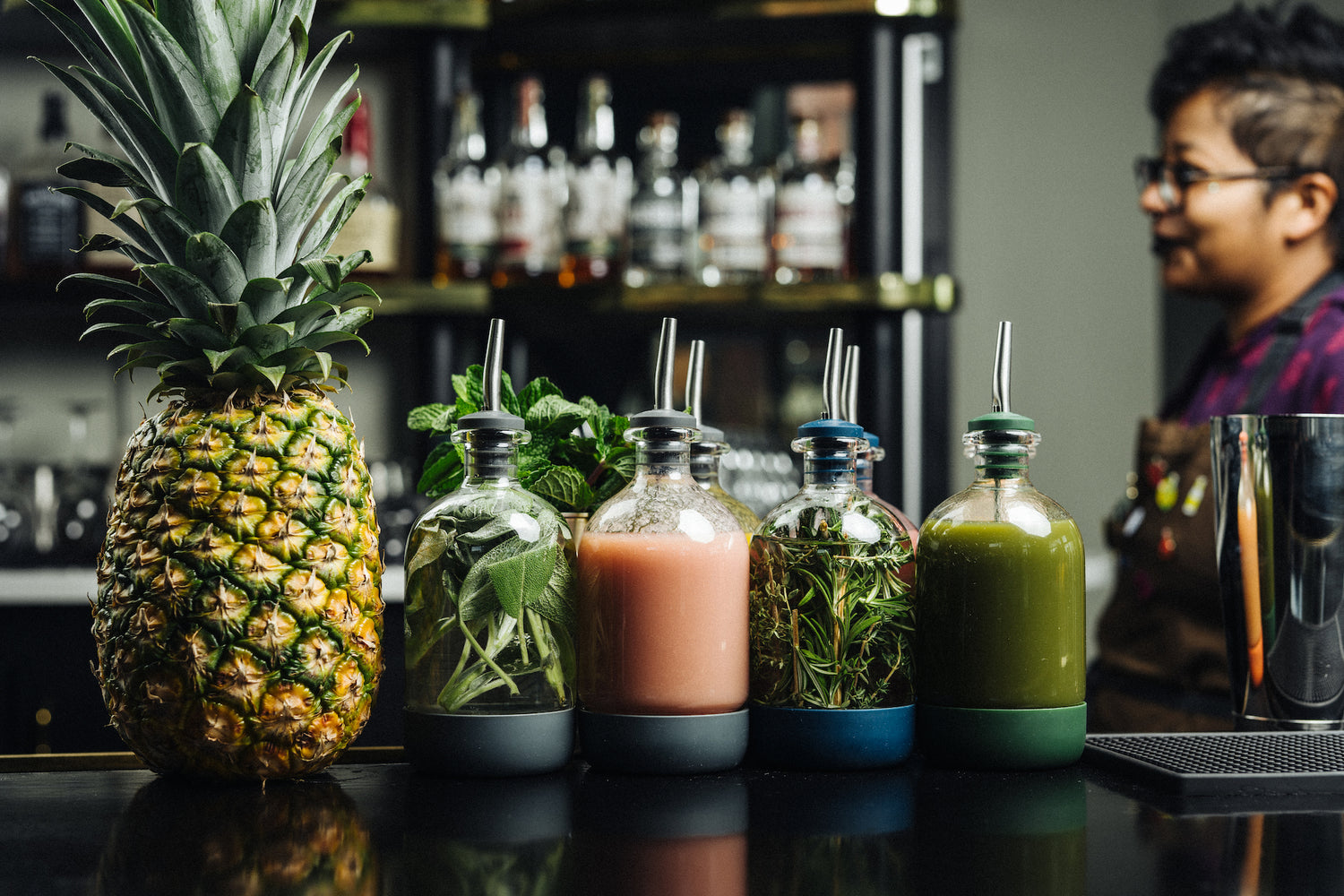 Bottles filled with simple syrups and fresh infusions