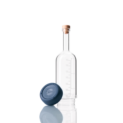Glass Crew Bottle with measurement lines and a removable base Crew Blue color on white background