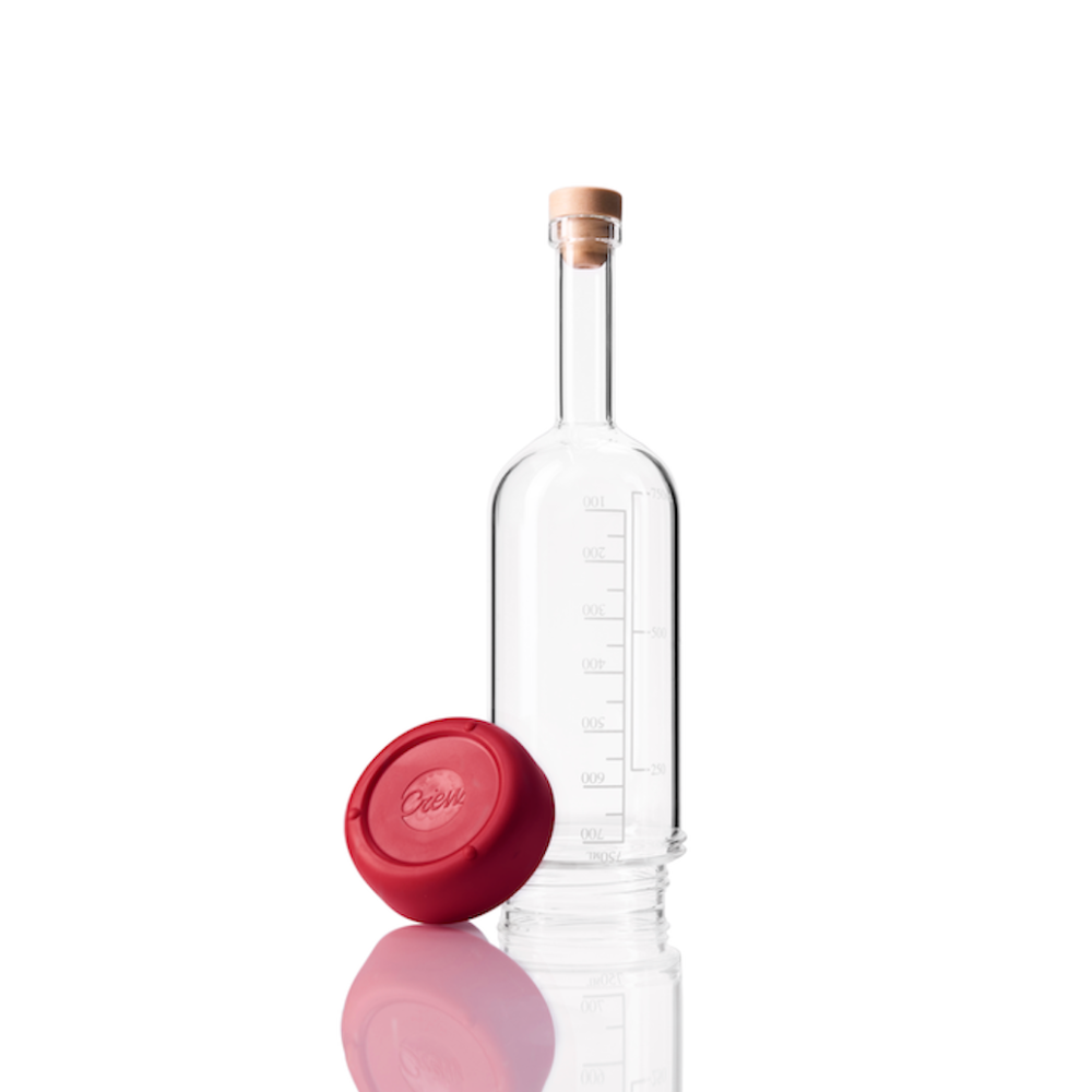 Glass Crew Bottle with measurement lines and a removable base Merlot red color on white background