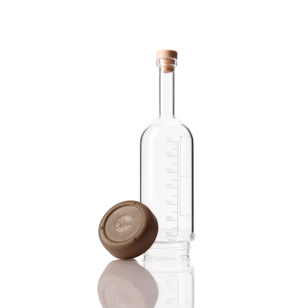 Glass Crew Bottle with measurement lines and a removable base Mocha brown color on white background