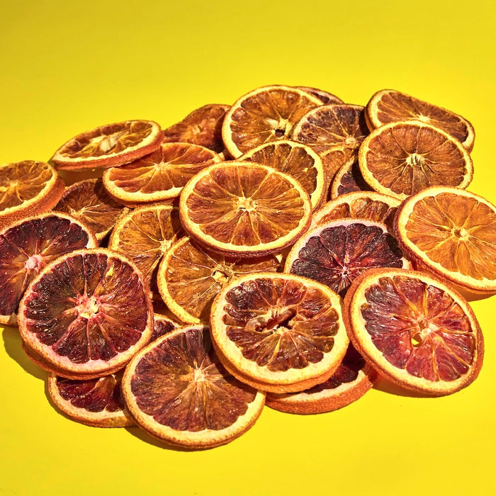 Pile of dehydrated blood orange slices in bulk for craft cocktail bar.