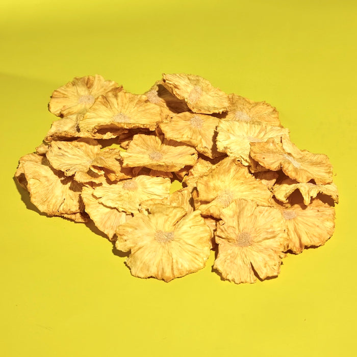 Pile of dehydrated pineapple slices in bulk for craft cocktail bar