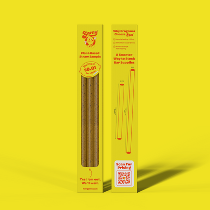 A boxed plant-based straw sample product standing upright on a bright yellow background. The package is primarily yellow with Coffee Ground straw samples visible through a clear window, plus printed text and a QR code.