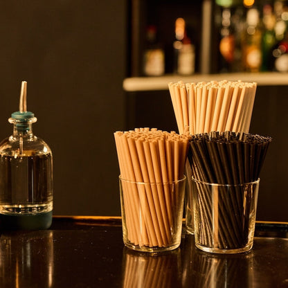 Prebatch barware and Plant based cocktail straws in glasses on a bartop
