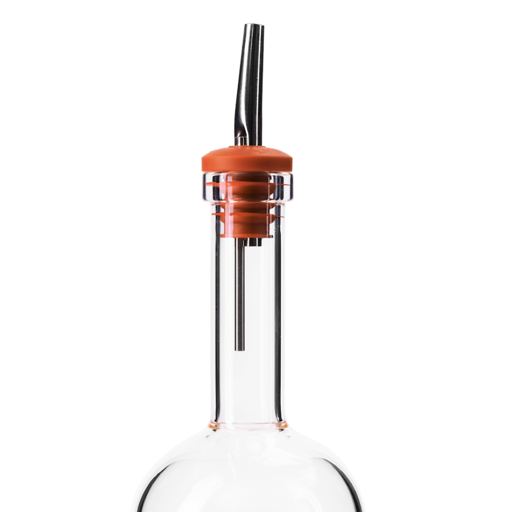 Glass batch bottle with orange pour spout on a white background