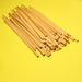 Pile of tall sustainable cocktail straws made from Wheat in Natural color